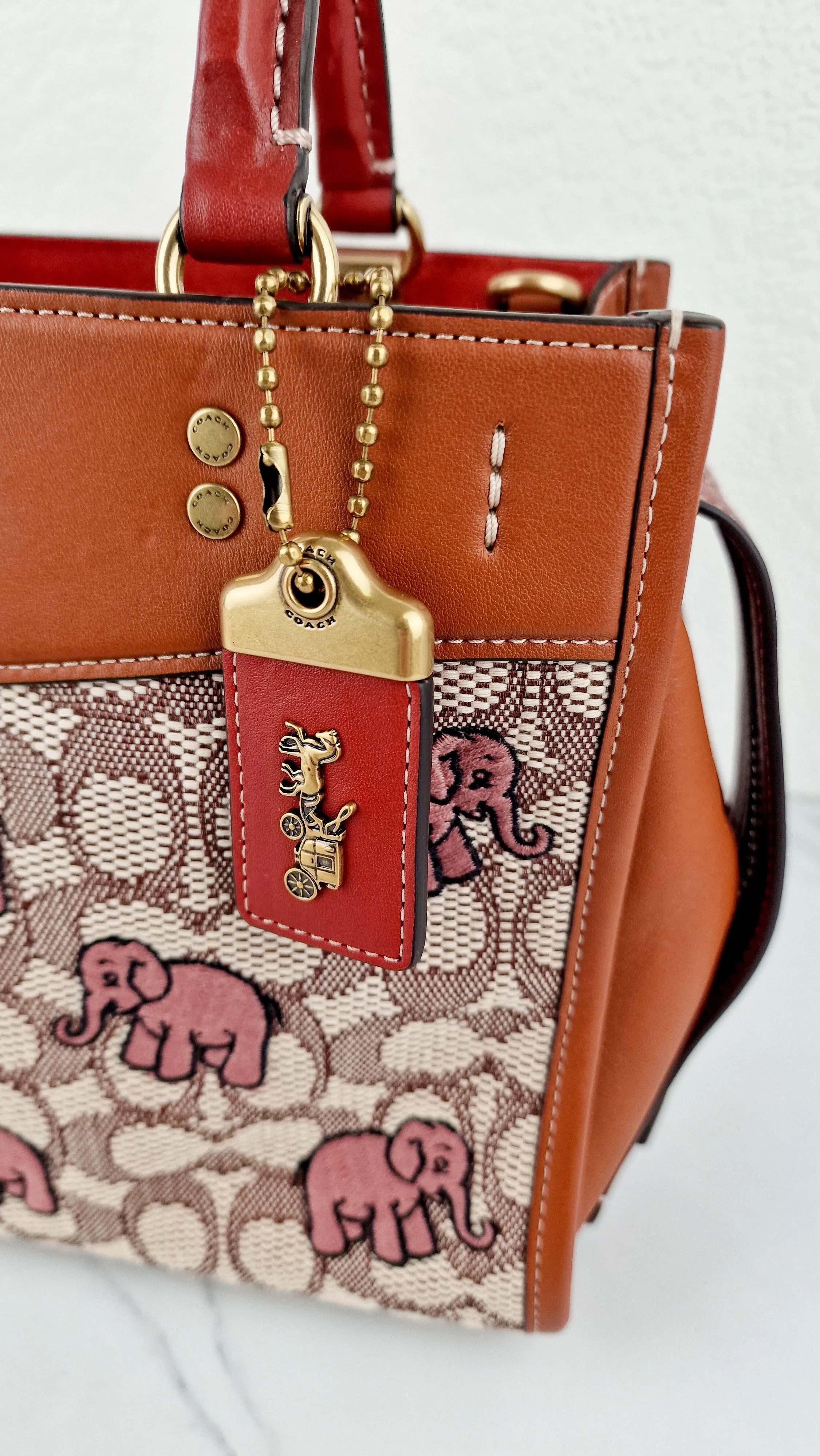 Coach Rogue 25 Signature Textile Jacquard with Embroidered Pink Elephants Handbag Coach C6165